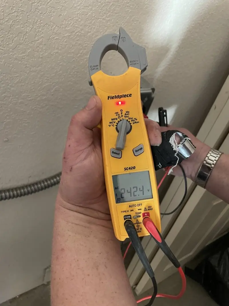 Voltage testing with clamp meter during Electrical Installation Services in Somers